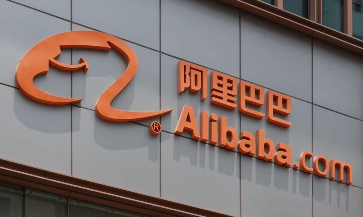 Orange Alibaba.com logo with Chinese characters on a gray building facade. The bold colors convey a modern, corporate tone.